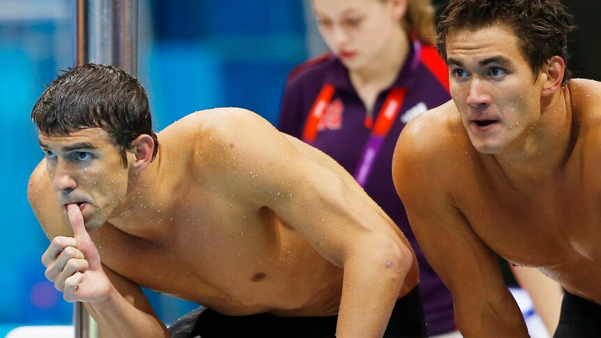 Michael Phelps and Nathan Adrian (R) of the US look on during the 4x100m freestyle relay final.