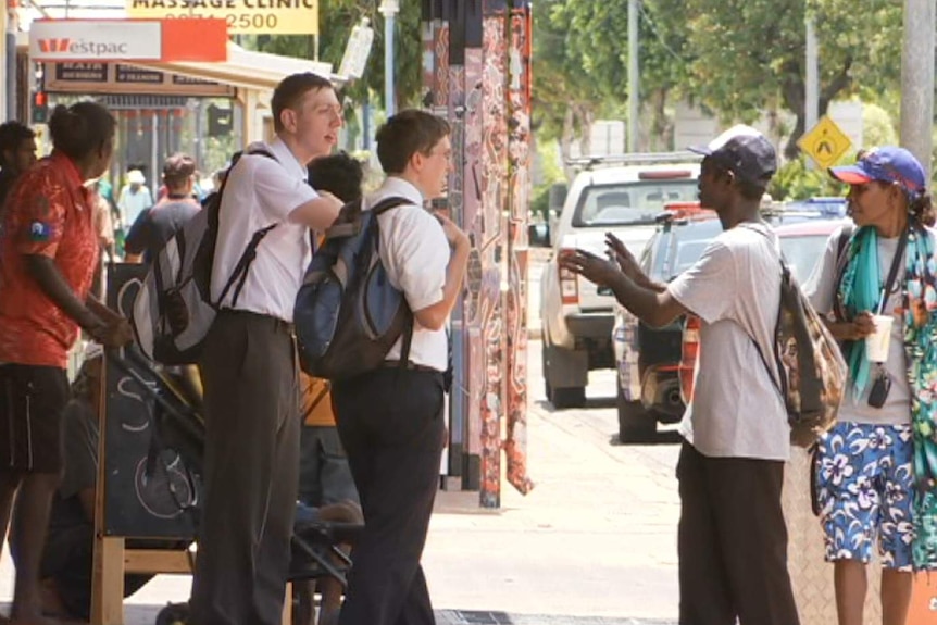 Missionaries chat on the street