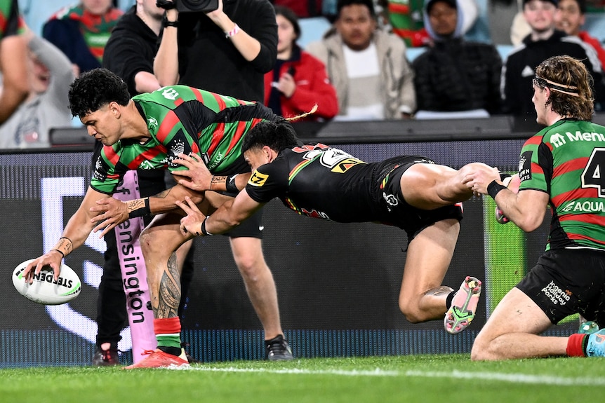 Taylan May stops Jaxson Paulo from scoring a try in the NRL game between the Panthers and Rabbitohs.