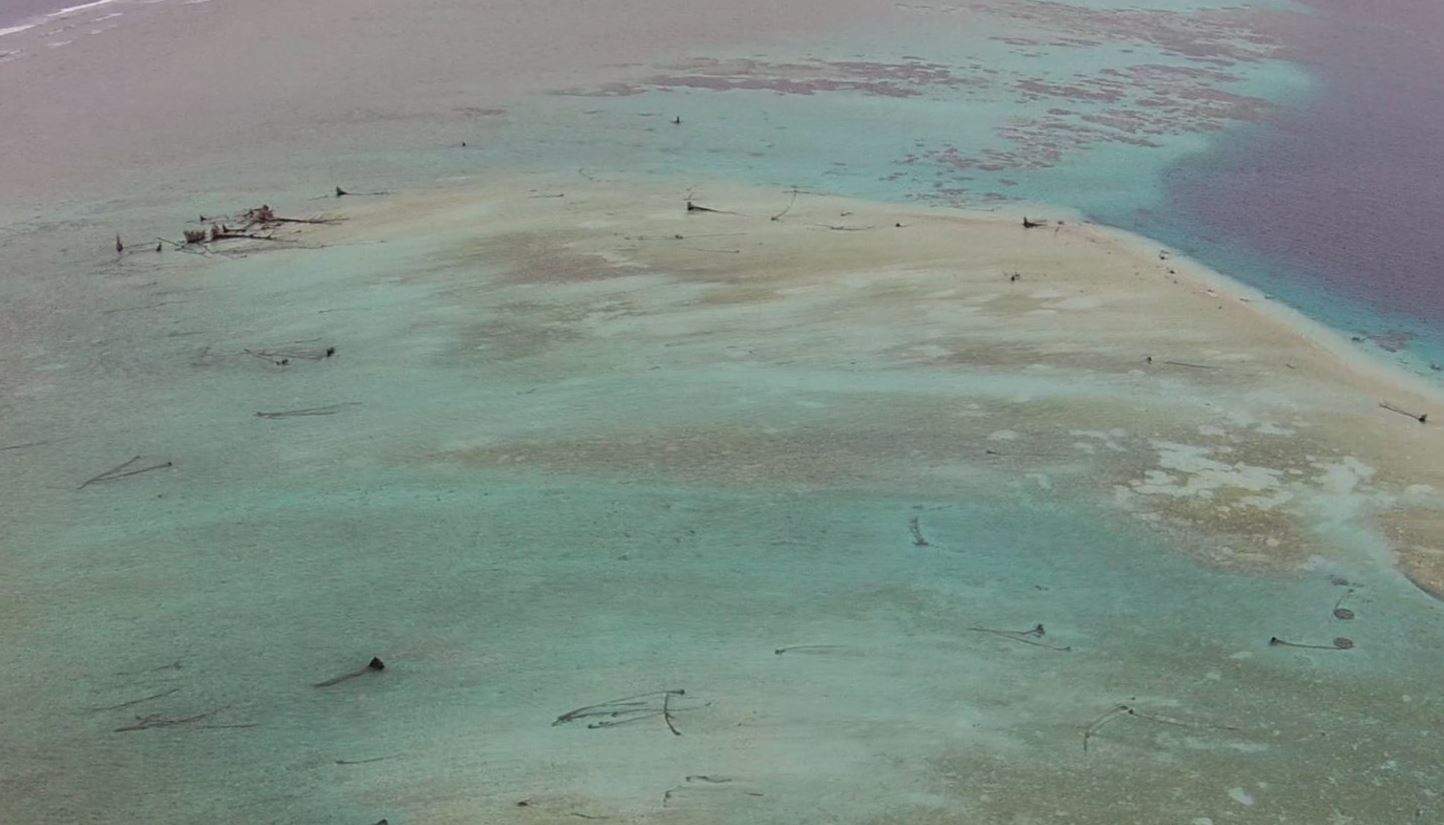 Eroded Pacific island due to rising sea levels