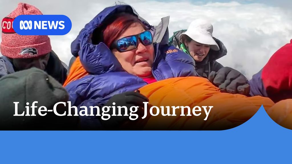 Life-Changing Journey_ A woman seated in a down jacket, with down gloves and a sleeping bag.