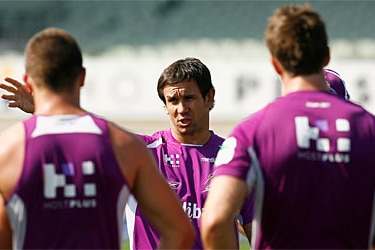 Matthew Johns speaks with Melbourne Storm players at a 2008 training session