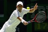 Andre Agassi plays a backhand against Joachim Johansson