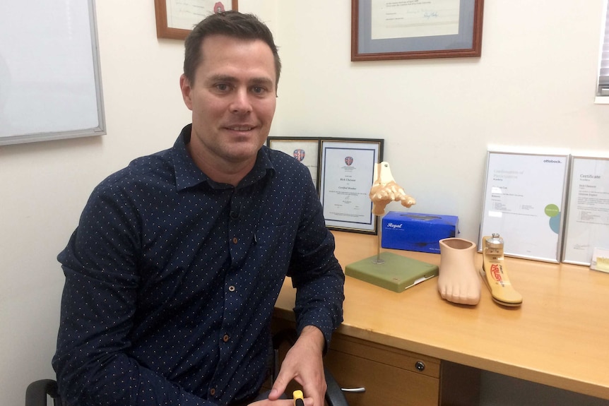 Stephen Cox at his desk.