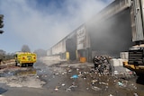 Smoke emits from the recycling centre.