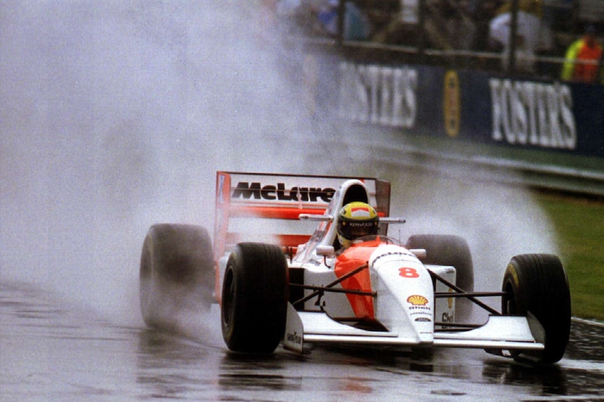 Ayrton Senna driving in the rain at Silverstone.