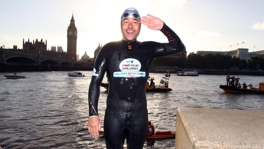 David Walliams salutes after finishing his 225km swim down the Thames