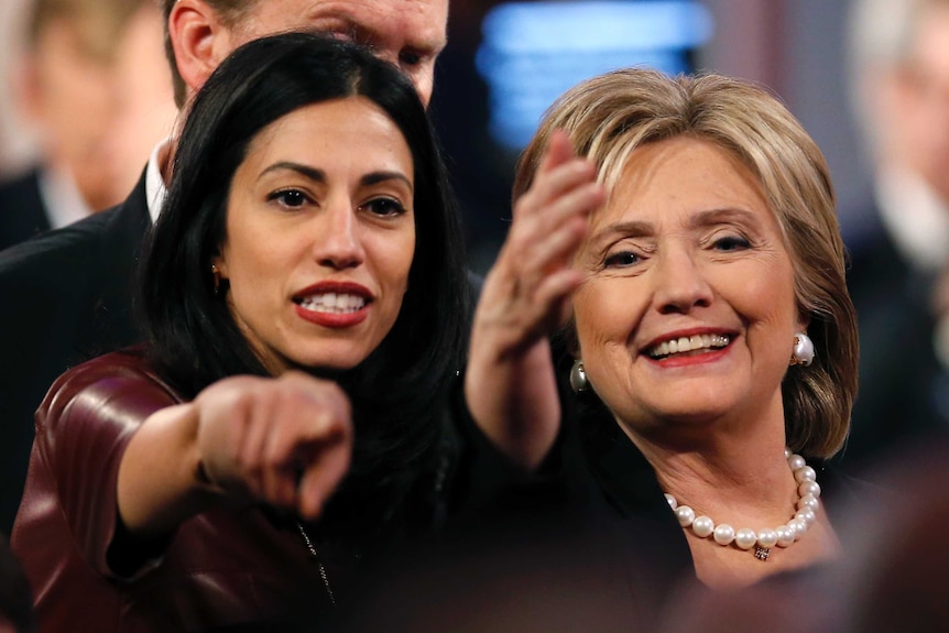 Huma Abedin stands next to Hillary Clinton at the end of the second official US Democratic presidential candidates debate.