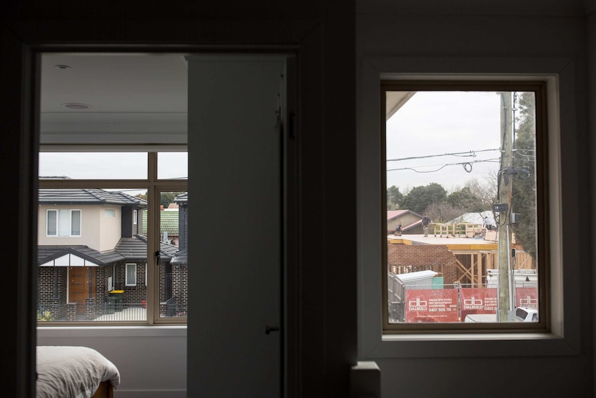 The view from the family's upstairs level looks out at houses across the street.