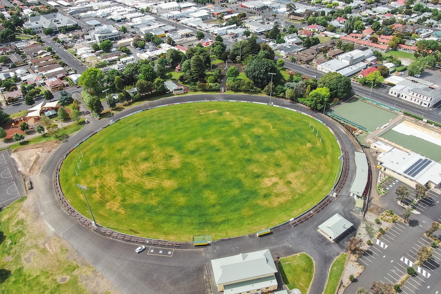 A football oval surrounded by suburbs, as seen from above.