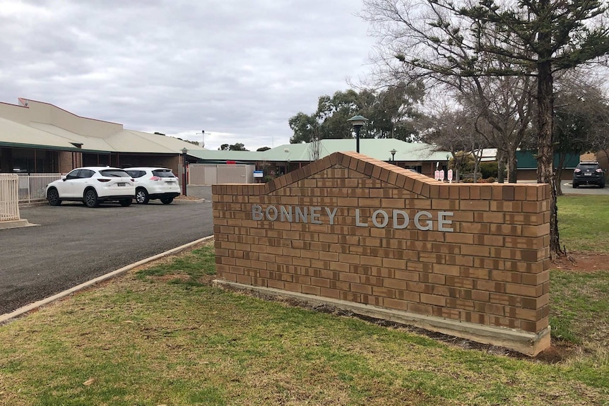 A brick sign at the entrance to an aged care home