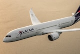 A plane with the LATAM Airlines logo flying