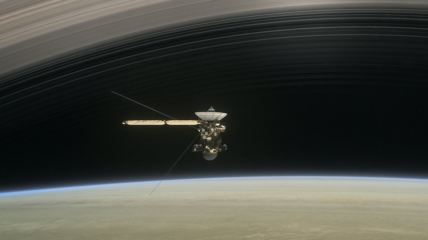 Artist's concept of Cassini diving between Saturn and its rings