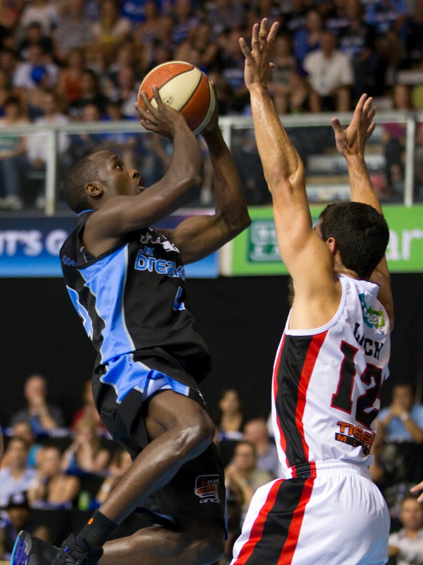 Breaking it down ... Cedric Jackson takes it to the hole against Kevin Lisch.