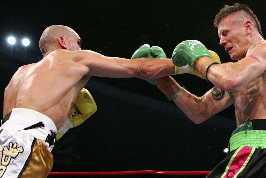 Anthony Mundine punches Danny Green during their 2006 Fight