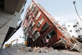 A building standing on an angle after an earthquake