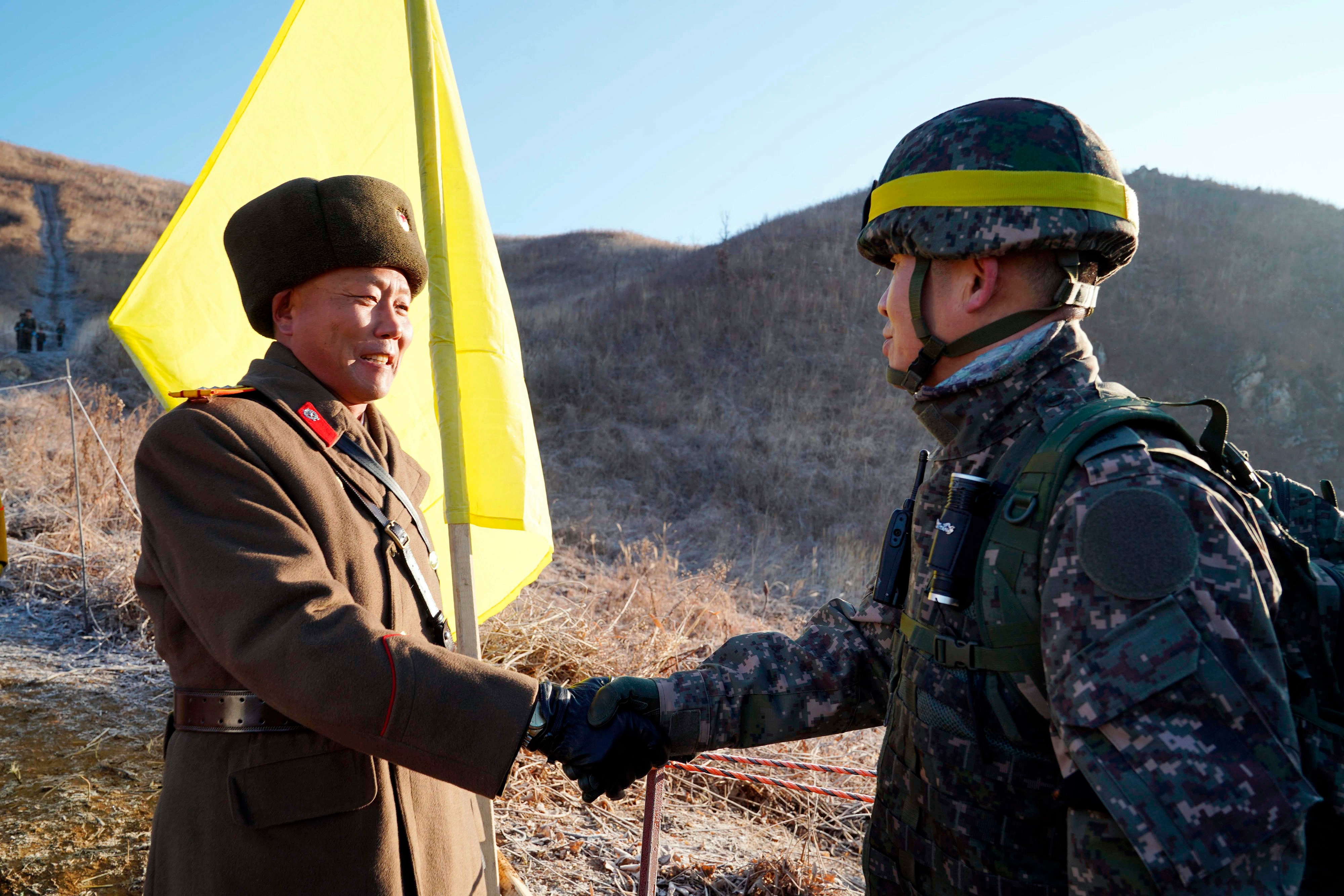 North And South Korean Soldiers Shake Hands, Exchange Cigarettes During ...