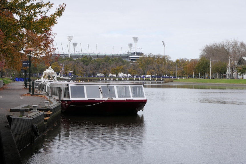 A Yarra river cruise boat sits in front of the MCG.
