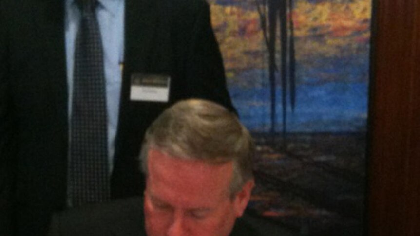Premier Colin Barnett signs a land access deal with Woodside and traditional owners