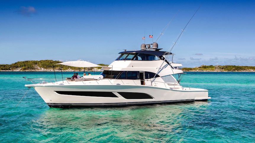 People relaxing on the bow of a Riviera 72 Sports Motor Yacht.