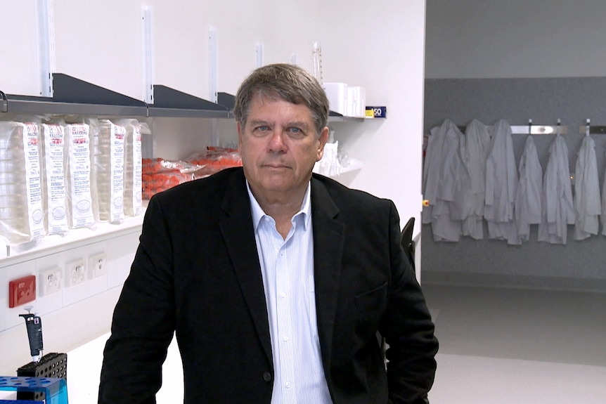 Professor Alan Trounson poses for a photo in a laboratory.