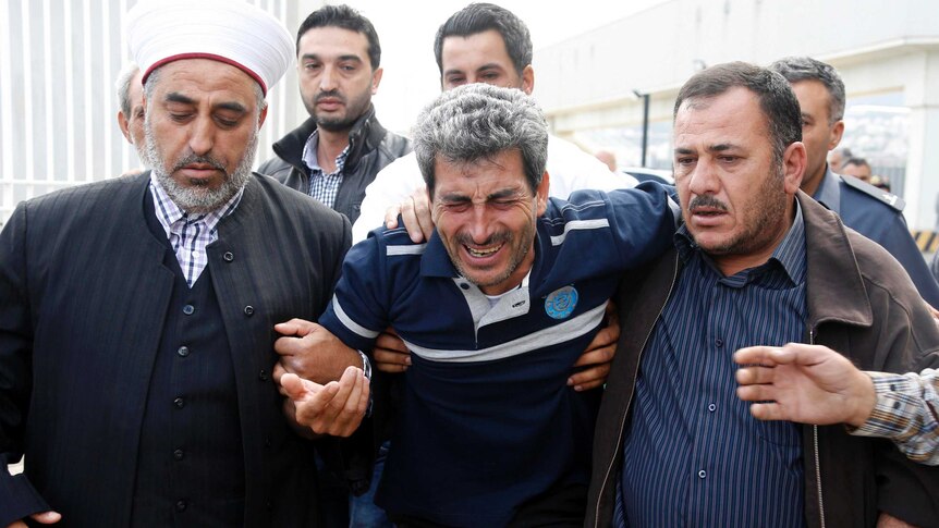 Hussein Ahmed Khodor mourns for his wife and eight children.