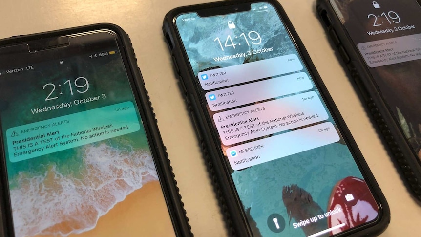 Phones displaying presidential alerts
