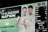 A big screen scoreboard shows the Sydney Thunder all out for 15 runs