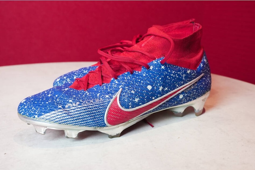 Newcastle Knights captain Kalyn Ponga's custom boots, which are red and blue