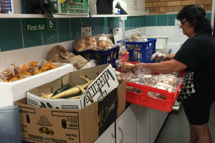 Staff and volunteers at the Adventist Development and Relief Agency in Logan make food parcels for those in need..