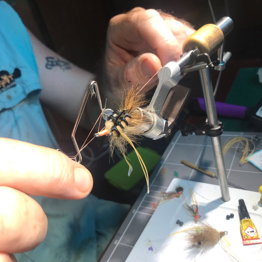 An imitation prawn fly being tied by Top End fishing guide Watty