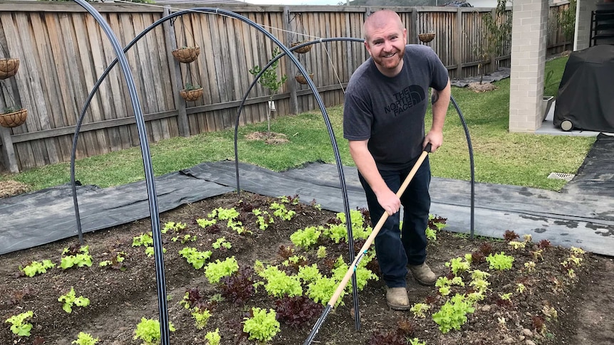 Marc Clapton, working in his market garden in his backyard.