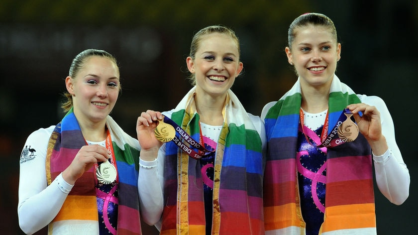 Clean sweep: Lauren Mitchell (c), Emily Little (l) and Georgia Bonora (r) took out a trifecta in the women's individual all-round gymnastics.
