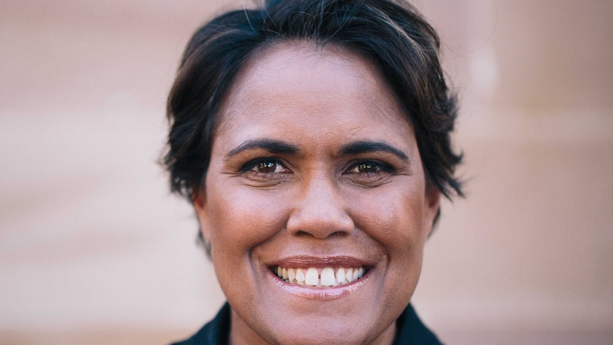A photo showing the smiling face of Indigenous Olympic champion Catherine Freeman with short hair.