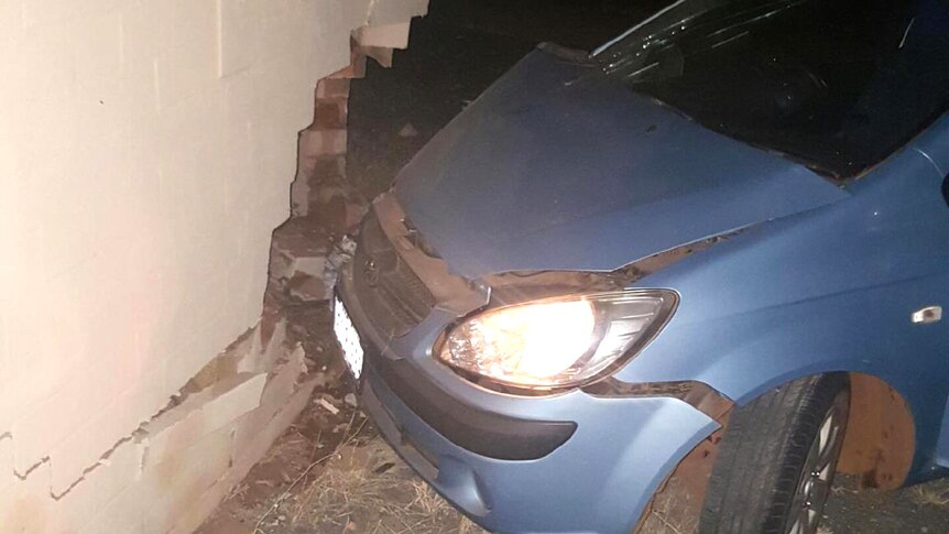 A small blue car crashed into a wall in Port Hedland