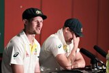 Steve Smith breaks into laughter as Cameron Bancroft speaks.