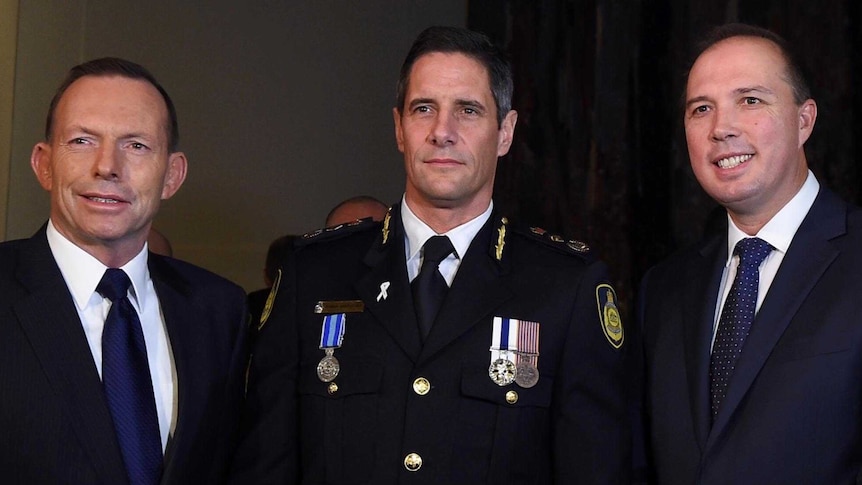 Commissioner Quaedvlieg (C) at the swearing in ceremony with Tony Abbott and Peter Dutton.