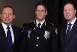 Commissioner Quaedvlieg (C) at the swearing in ceremony with Tony Abbott and Peter Dutton.
