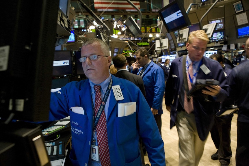 Traders work on the floor of the New York Stock Exchange in New York on September 15, 2008