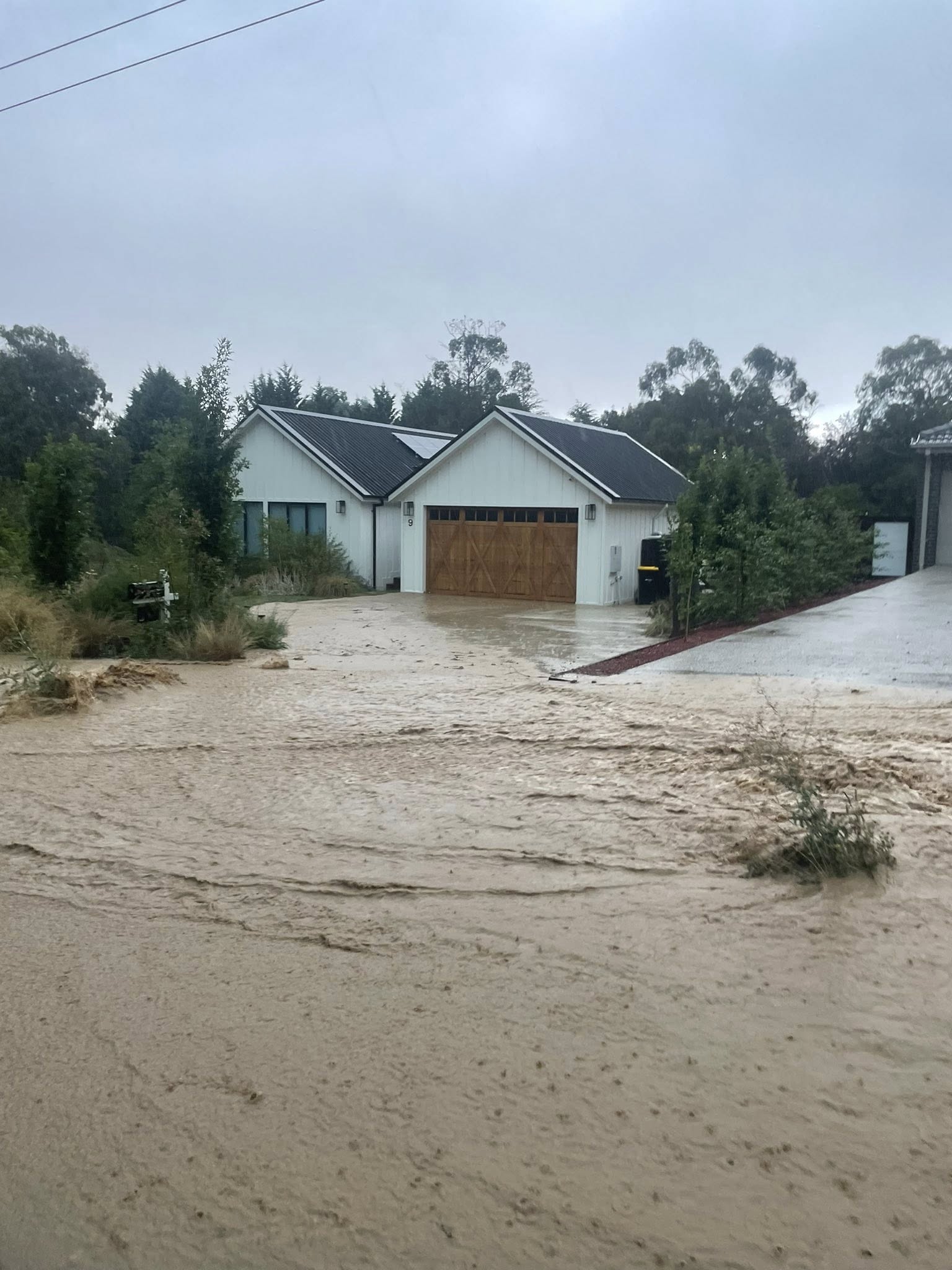 Residents blame housing development after flash flooding
