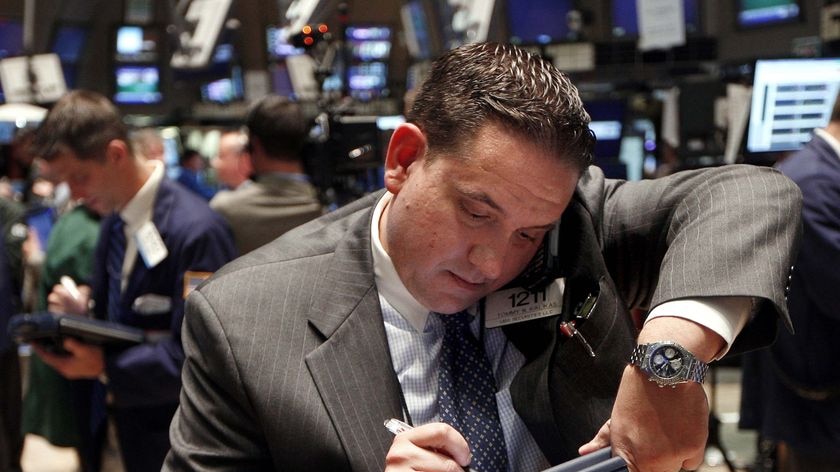 A trading specialist works on the floor at the New York Stock Exchange.
