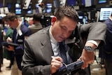 A trading specialist works on the floor at the New York Stock Exchange
