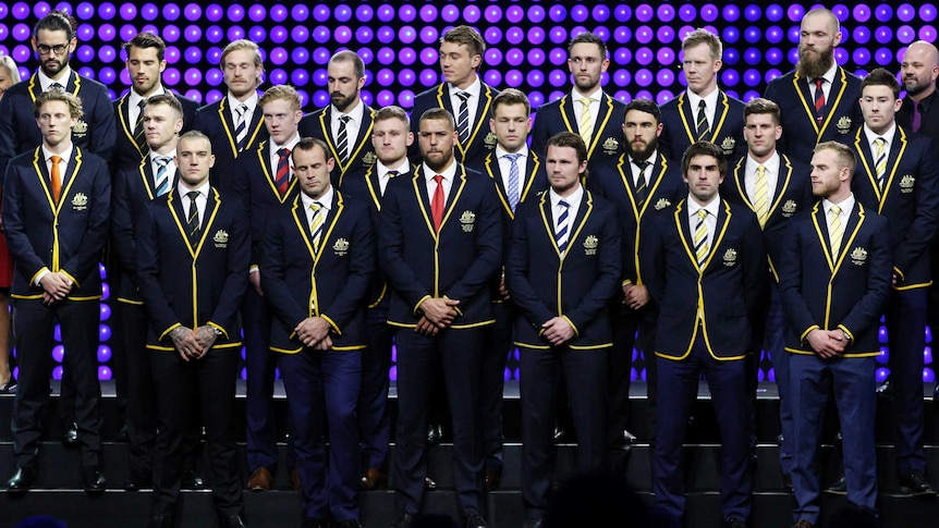 The line-up of the All-Australian team standing on stage