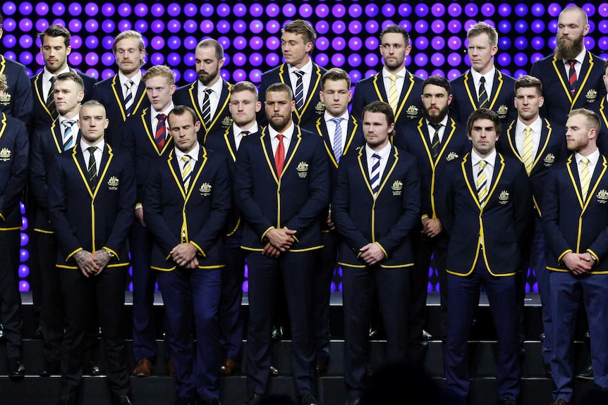 The line-up of the All-Australian team standing on stage