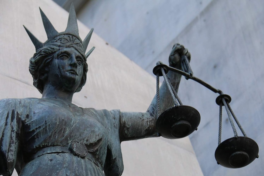 Close-up shot of Scales of Justice statue.