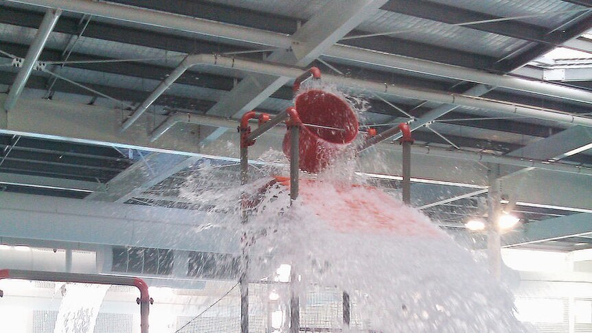 A water slide is ready for action as the new State Aquatic Centre at Marion opens its doors for the first time to public swimming.