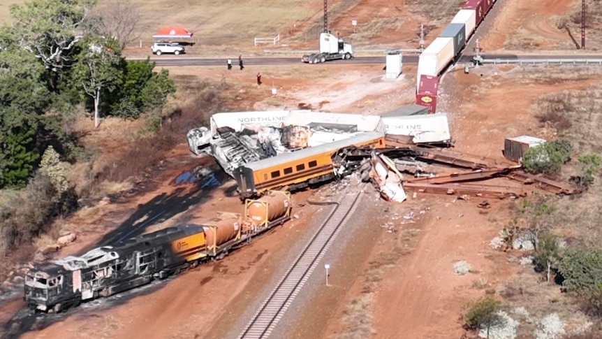 an aerial photo of a train crash