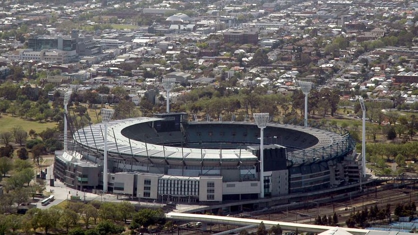 An overnight downpour has soaked the MCG turf.