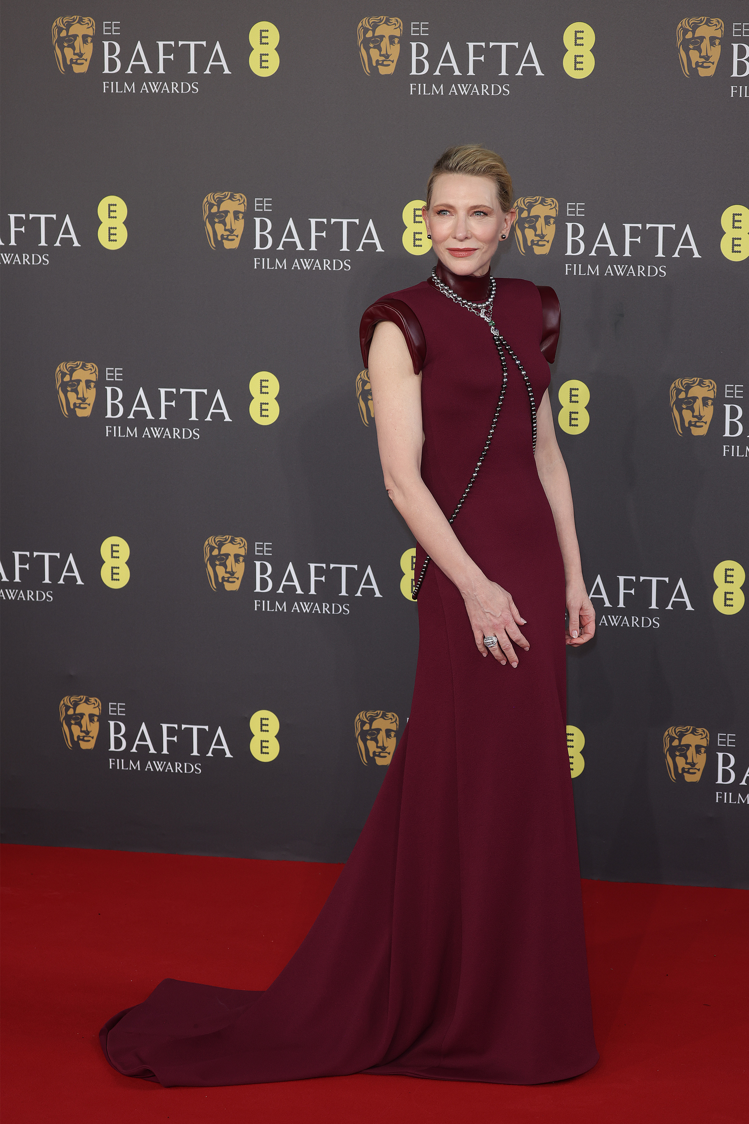 Cate Blanchett wearing a burgundy dress on the red carpet