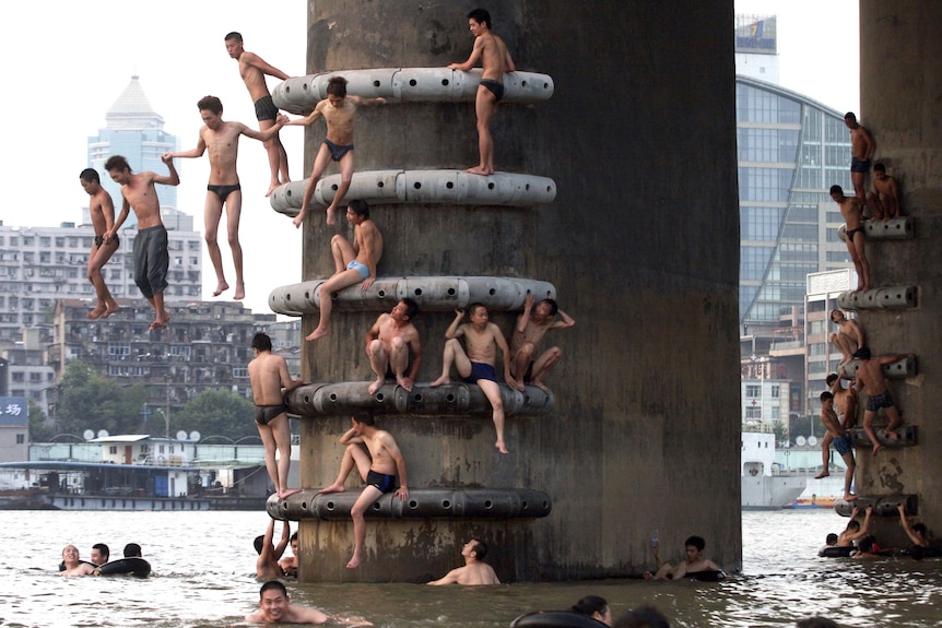 Residents jump into the Yangtze River in China